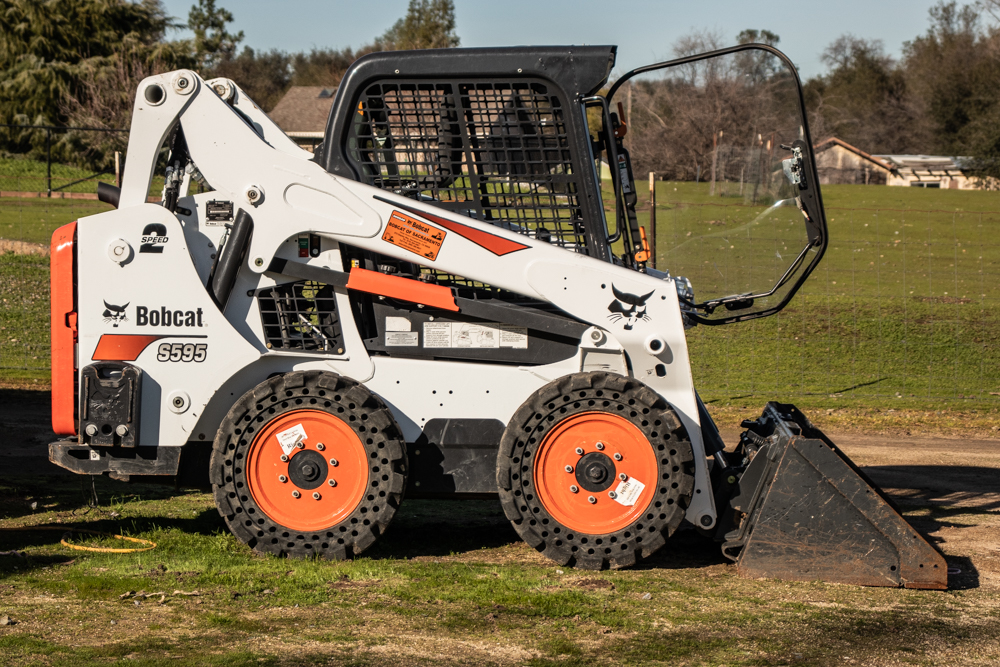 How Terrain Type Impacts Your Choice of Rock Wheels for a Skid Steer?